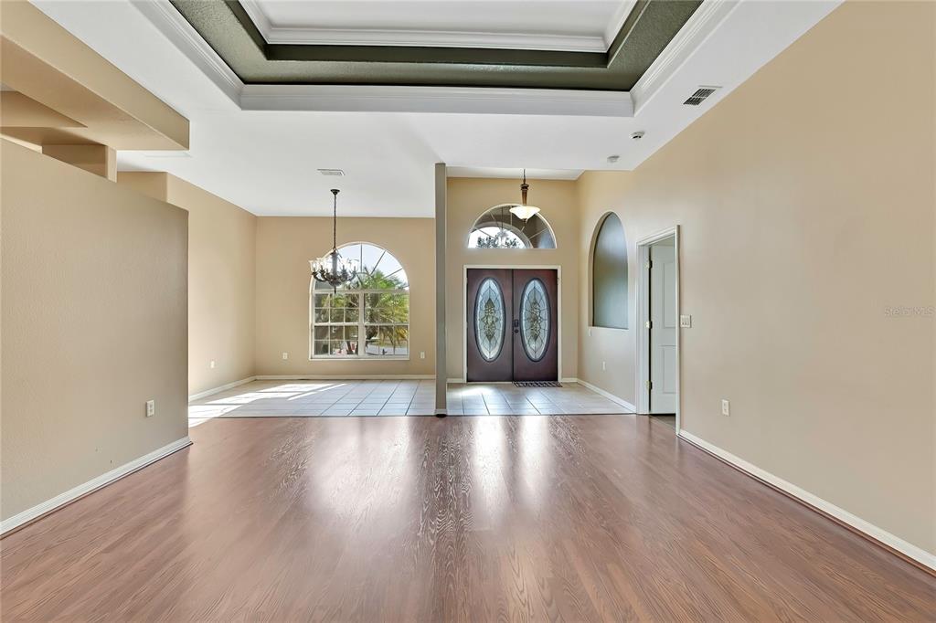 12403 Centennial Street Spring Hill, FL 34609 - Photo 10 of 62 a view of an entryway with wooden floor