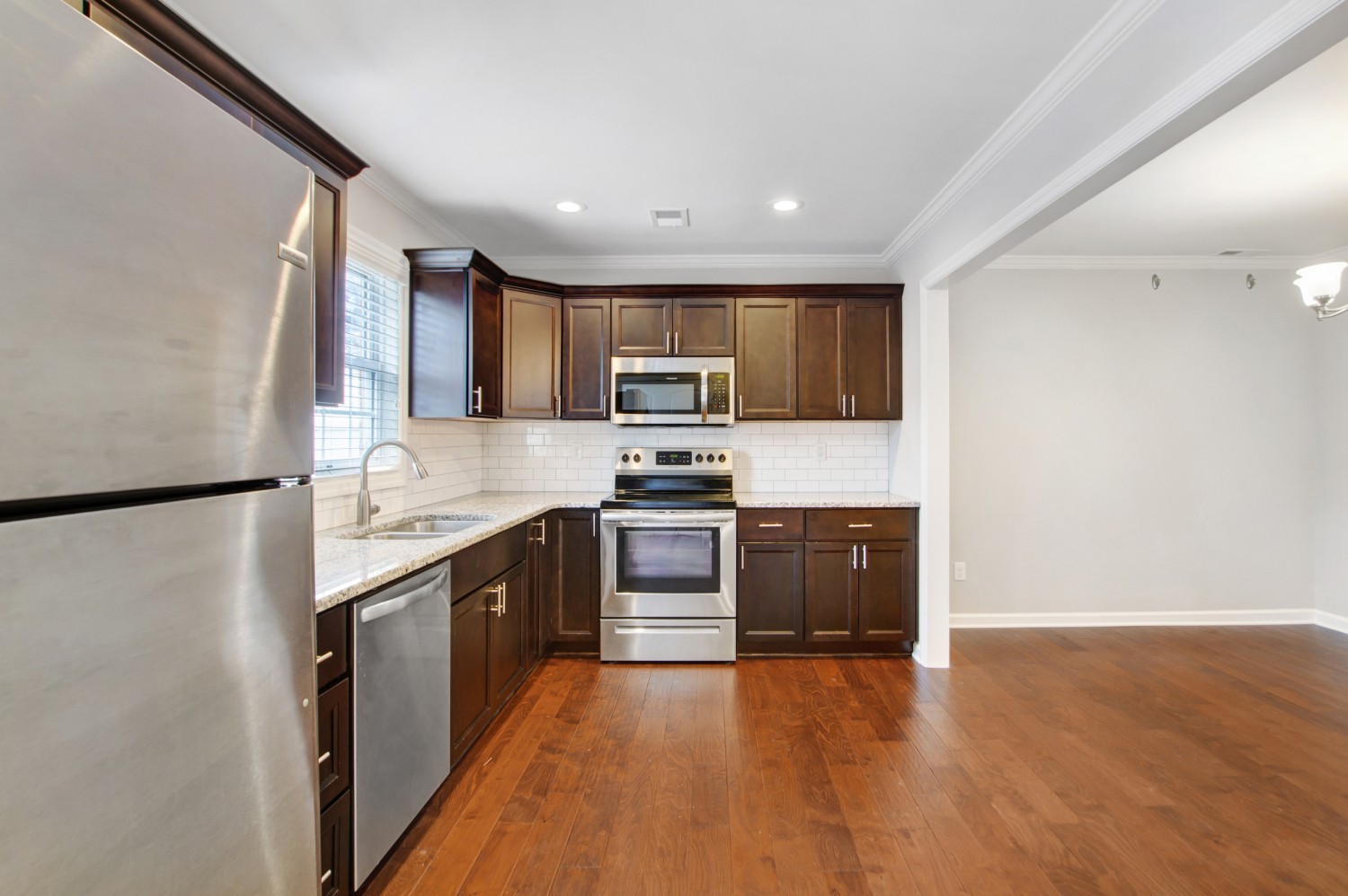 113 Cages Road, Unit 3 Hendersonville, TN 37075 - Photo 11 of 30 a kitchen with granite countertop a refrigerator stove top oven and sink