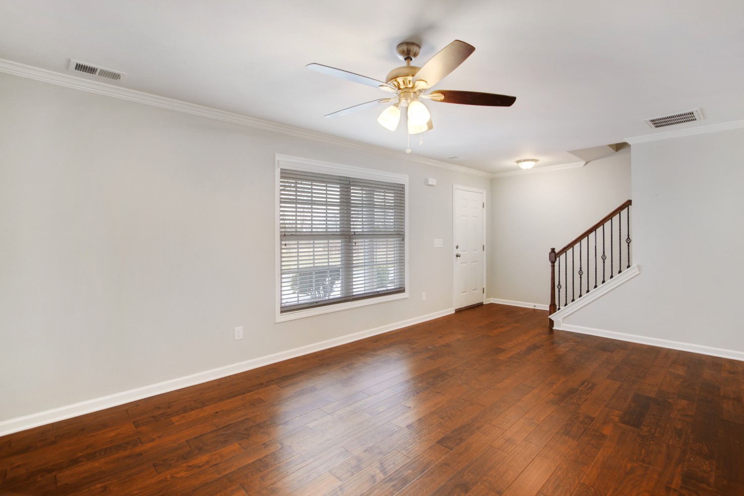 113 Cages Road, Unit 3 Hendersonville, TN 37075 - Photo 4 of 30 an empty room with wooden floor fan and windows