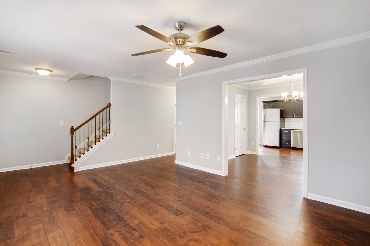 113 Cages Road, Unit 3 Hendersonville, TN 37075 - Photo 5 of 30 a view of an empty room with wooden floor and a ceiling fan