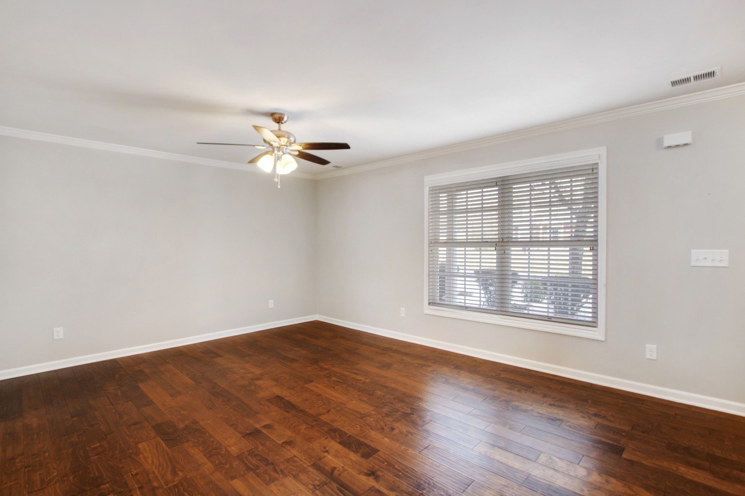 113 Cages Road, Unit 3 Hendersonville, TN 37075 - Photo 7 of 30 an empty room with wooden floor chandelier fan and windows