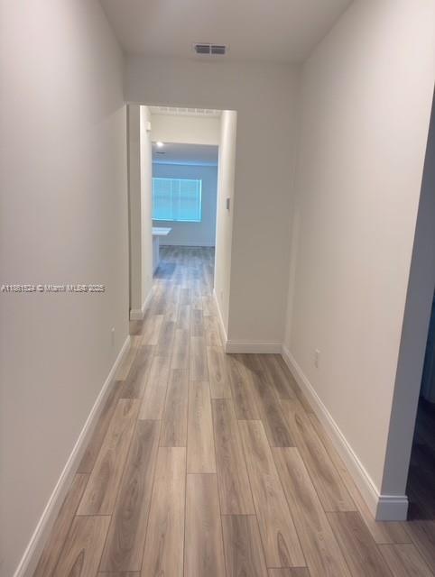 6576 Cloverdale Avenue Port St. Lucie, FL 34987 - Photo 16 of 32 a view of a room with wooden floor and a sink