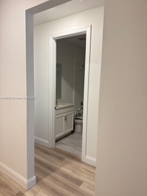 6576 Cloverdale Avenue Port St. Lucie, FL 34987 - Photo 19 of 32 a view of a hallway with wooden floor