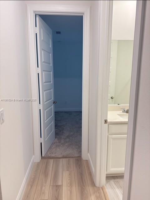 6576 Cloverdale Avenue Port St. Lucie, FL 34987 - Photo 22 of 32 a view of walk in closet with empty racks