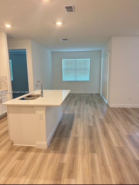 6576 Cloverdale Avenue Port St. Lucie, FL 34987 - Photo 28 of 32 a view of wooden floor and utility room