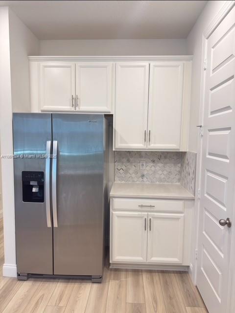 6576 Cloverdale Avenue Port St. Lucie, FL 34987 - Photo 30 of 32 a kitchen with white cabinets and white appliances