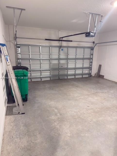 6576 Cloverdale Avenue Port St. Lucie, FL 34987 - Photo 4 of 32 a view of a garage with white walls