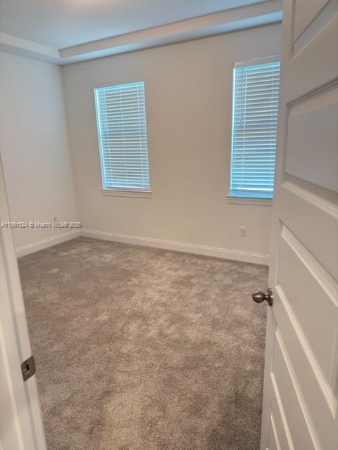 6576 Cloverdale Avenue Port St. Lucie, FL 34987 - Photo 6 of 32 a view of an empty room with a window