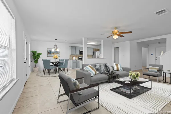 a living room with furniture and a table