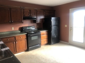 324 Bandera Lane Springfield, TN 37172 - Photo 10 of 11 a kitchen with stainless steel appliances granite countertop a stove a refrigerator and a cabinets