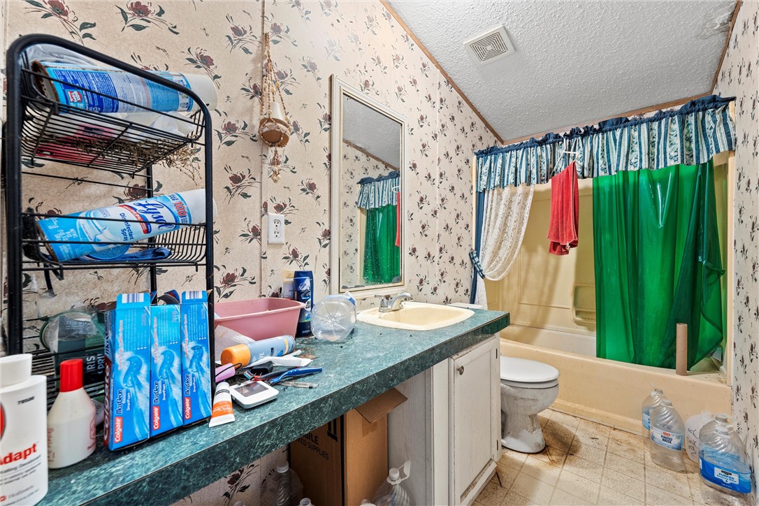 3725 Bluhm Road West, TX 76691 - Photo 12 of 26 a bathroom with a sink toilet and shower