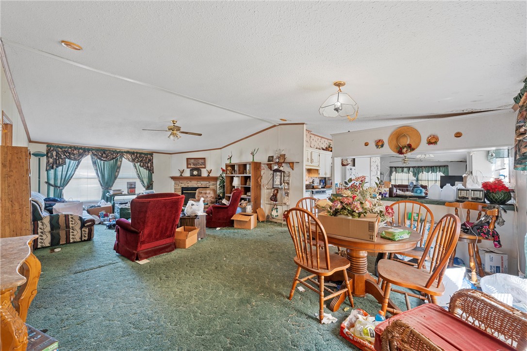3725 Bluhm Road West, TX 76691 - Photo 4 of 26 a living room with lots of furniture and a chandelier