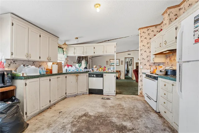 a view of a kitchen with furniture and a kitchen