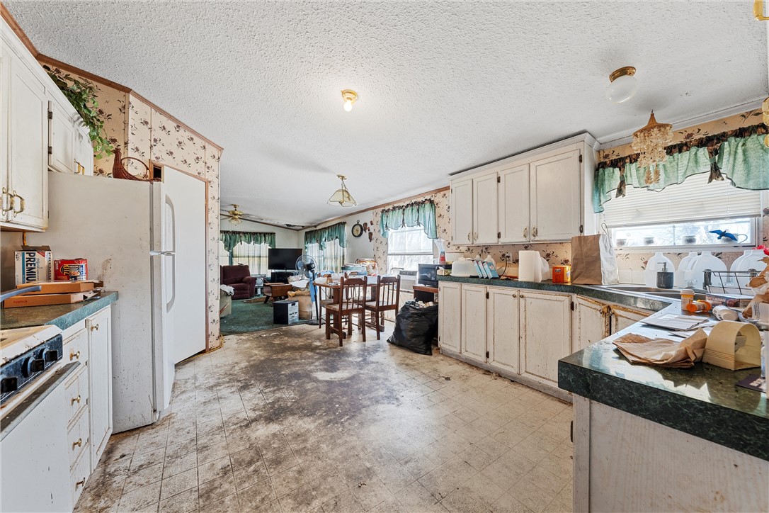 3725 Bluhm Road West, TX 76691 - Photo 9 of 26 a view of a kitchen with furniture and a kitchen