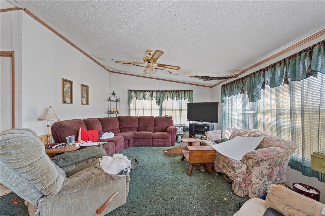 3725 Bluhm Road West, TX 76691 - Photo 10 of 26 a living room with furniture and a flat screen tv