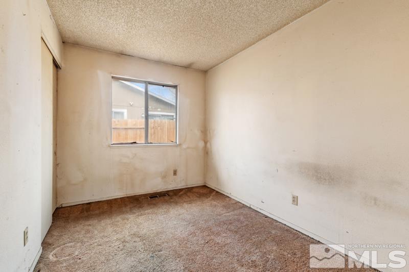 1376 Butler Street Reno, NV 89512 - Photo 9 of 12 an empty room with a window