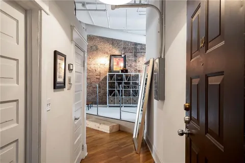 a view of a kitchen with refrigerator and stove