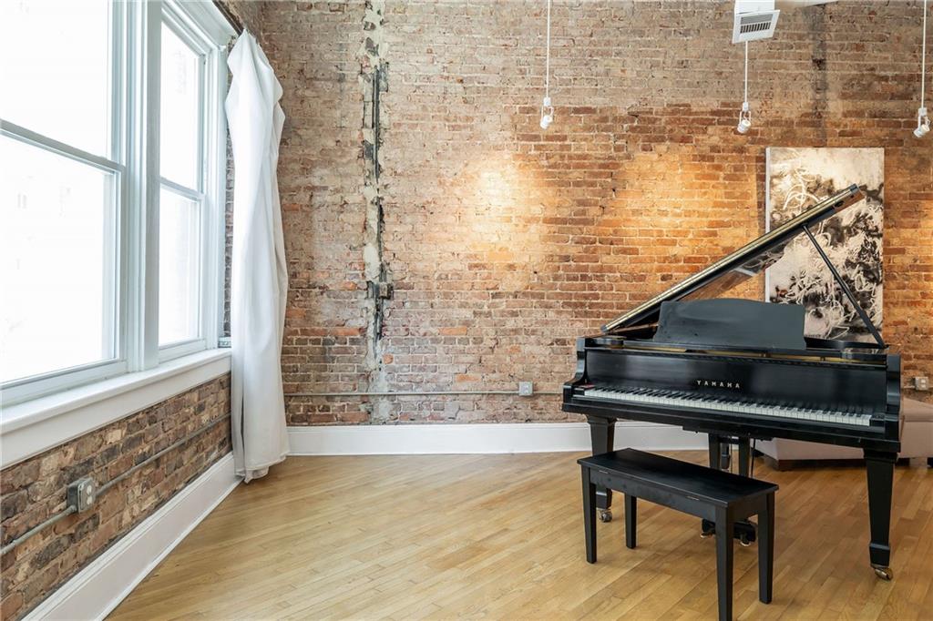 215 Mitchell Street Southwest, Unit 14 Atlanta, GA 30303 - Photo 25 of 37 a view of entryway with wooden floor and small seating area