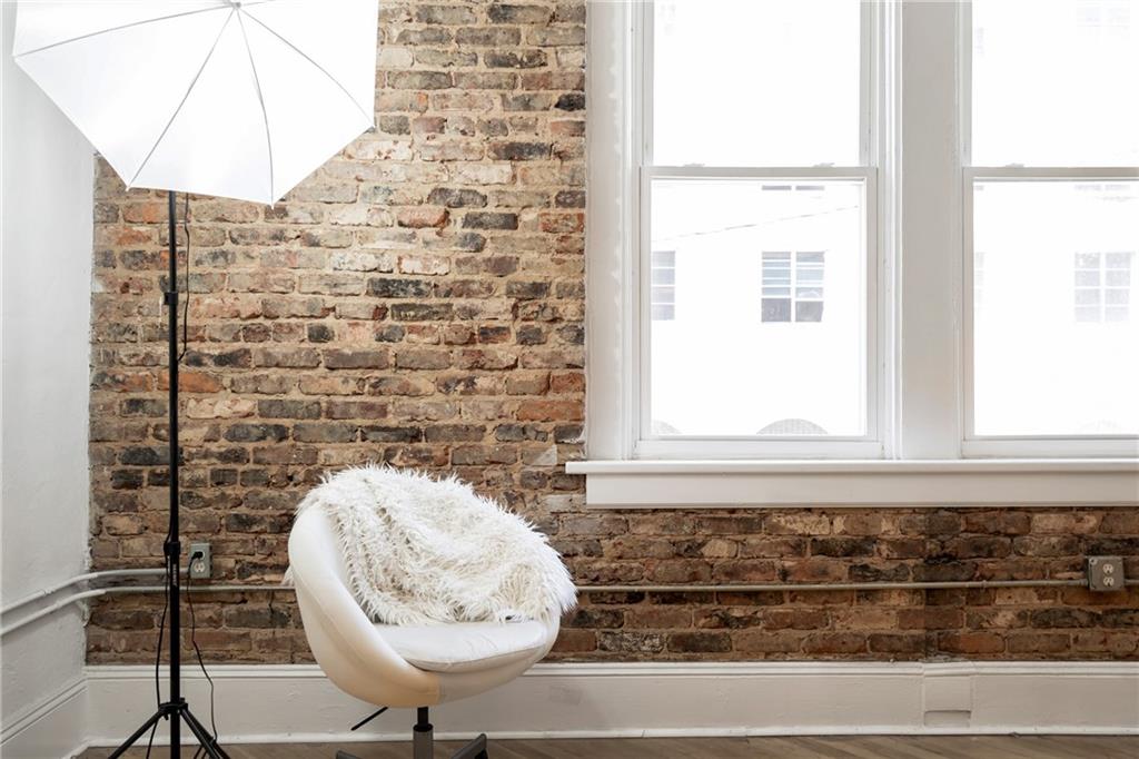 215 Mitchell Street Southwest, Unit 14 Atlanta, GA 30303 - Photo 27 of 37 a bathroom with a granite countertop sink and a window