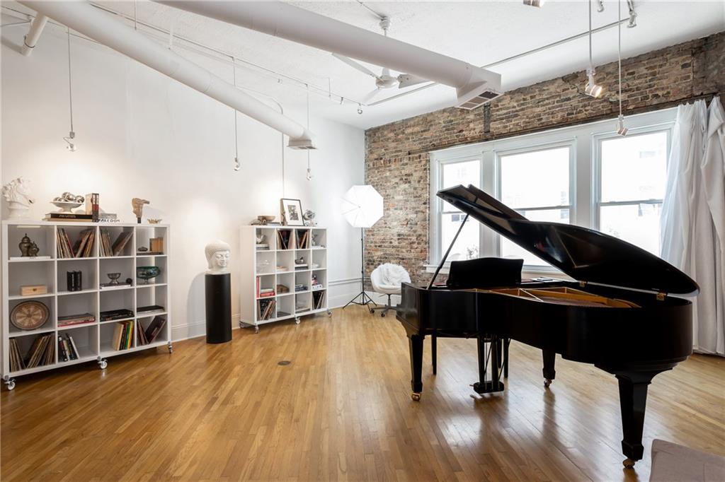 215 Mitchell Street Southwest, Unit 14 Atlanta, GA 30303 - Photo 28 of 37 a living room with furniture and wooden floor