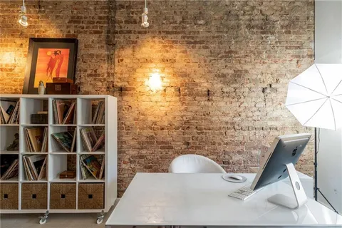 a lobby with furniture and floor to ceiling window