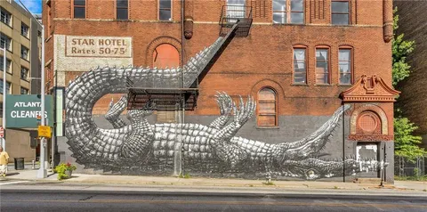 a front view of a building with a garden