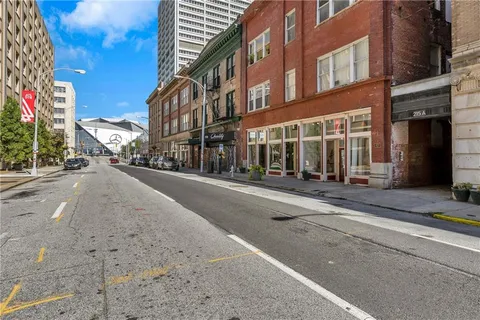 a view of a street with a building in the background