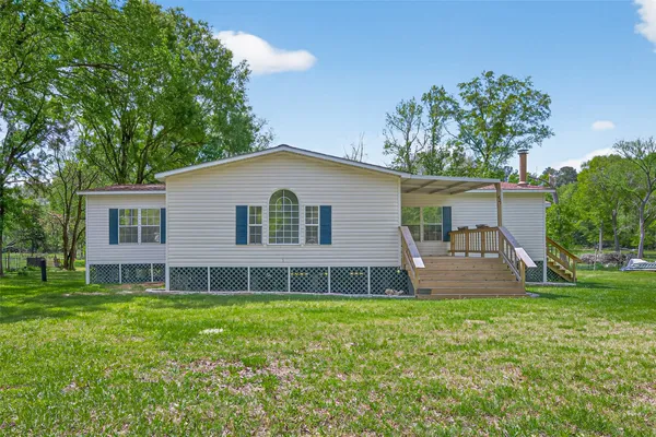 a view of an empty room with windows