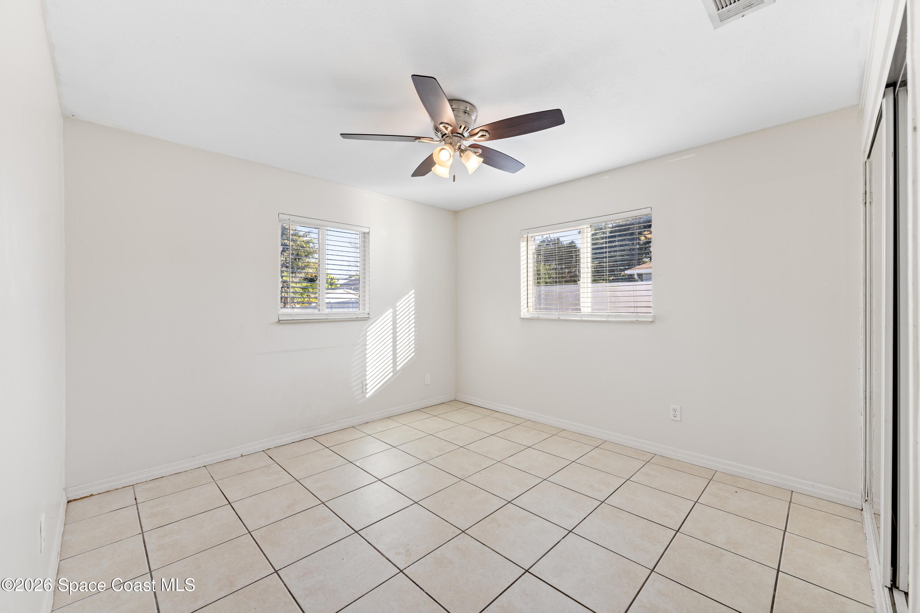 420 South Tropical Trail Merritt Island, FL 32952 - Photo 12 of 20 a view of an empty room and window