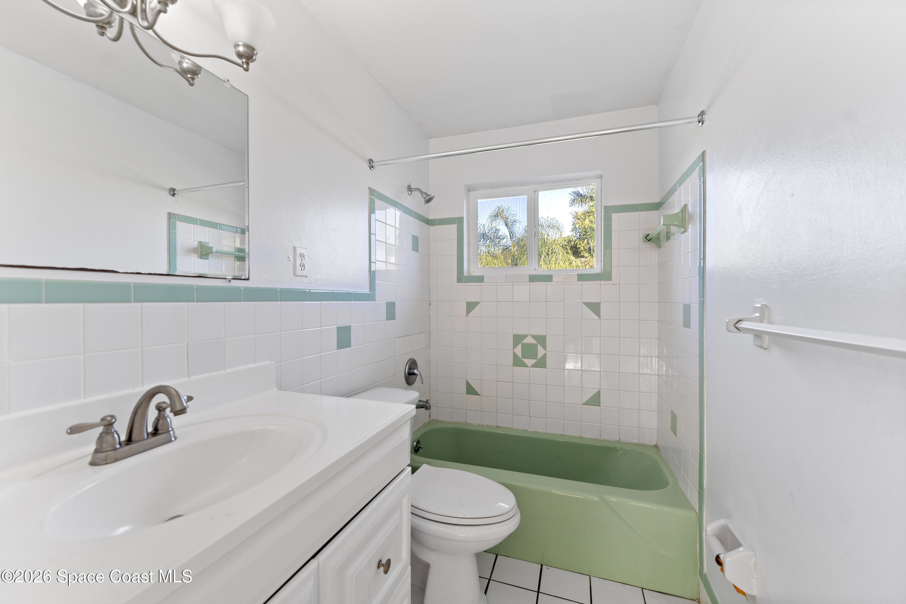 420 South Tropical Trail Merritt Island, FL 32952 - Photo 14 of 20 a bathroom with a sink toilet and shower