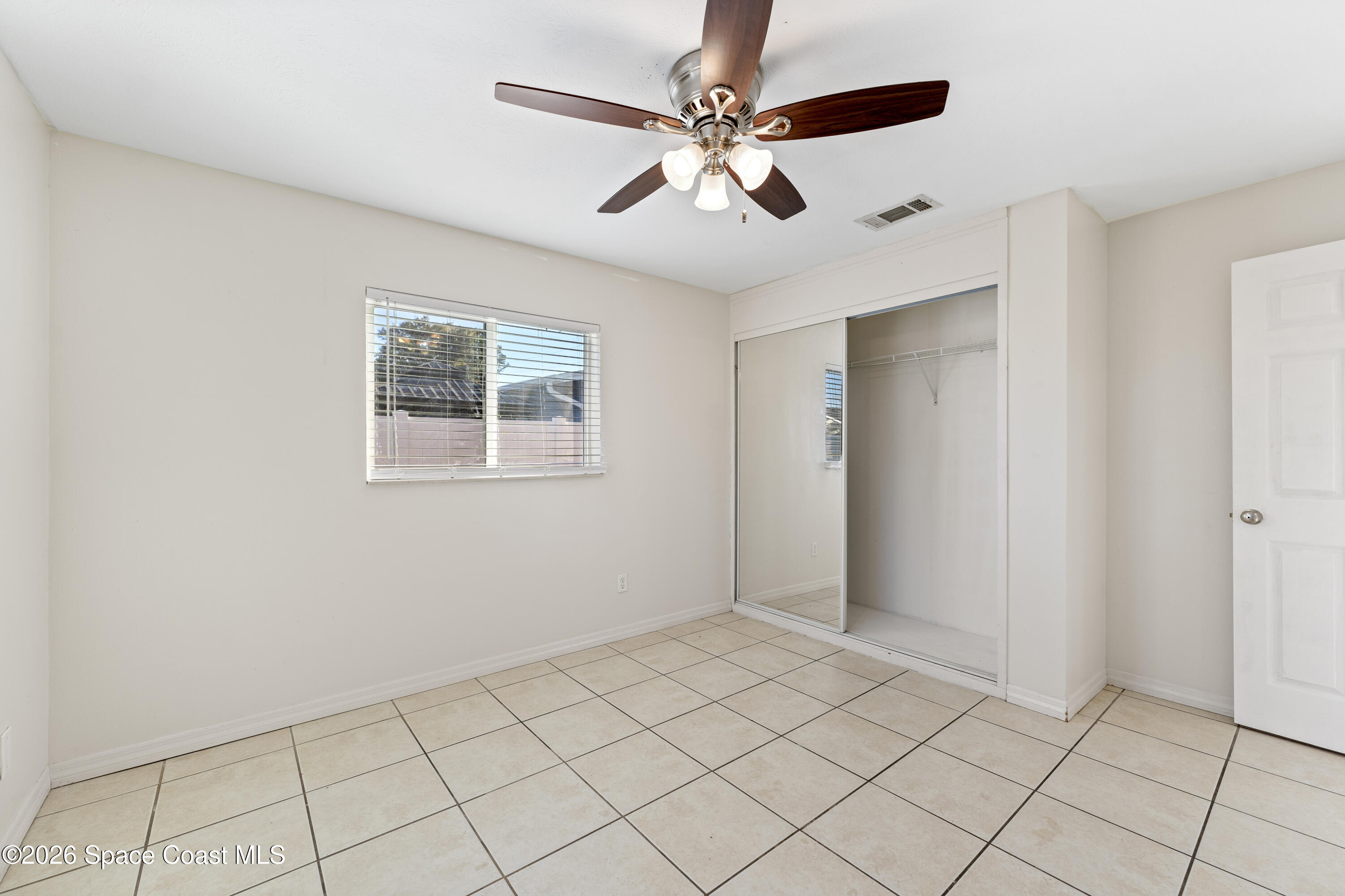 420 South Tropical Trail Merritt Island, FL 32952 - Photo 16 of 20 a view of an empty room with a window