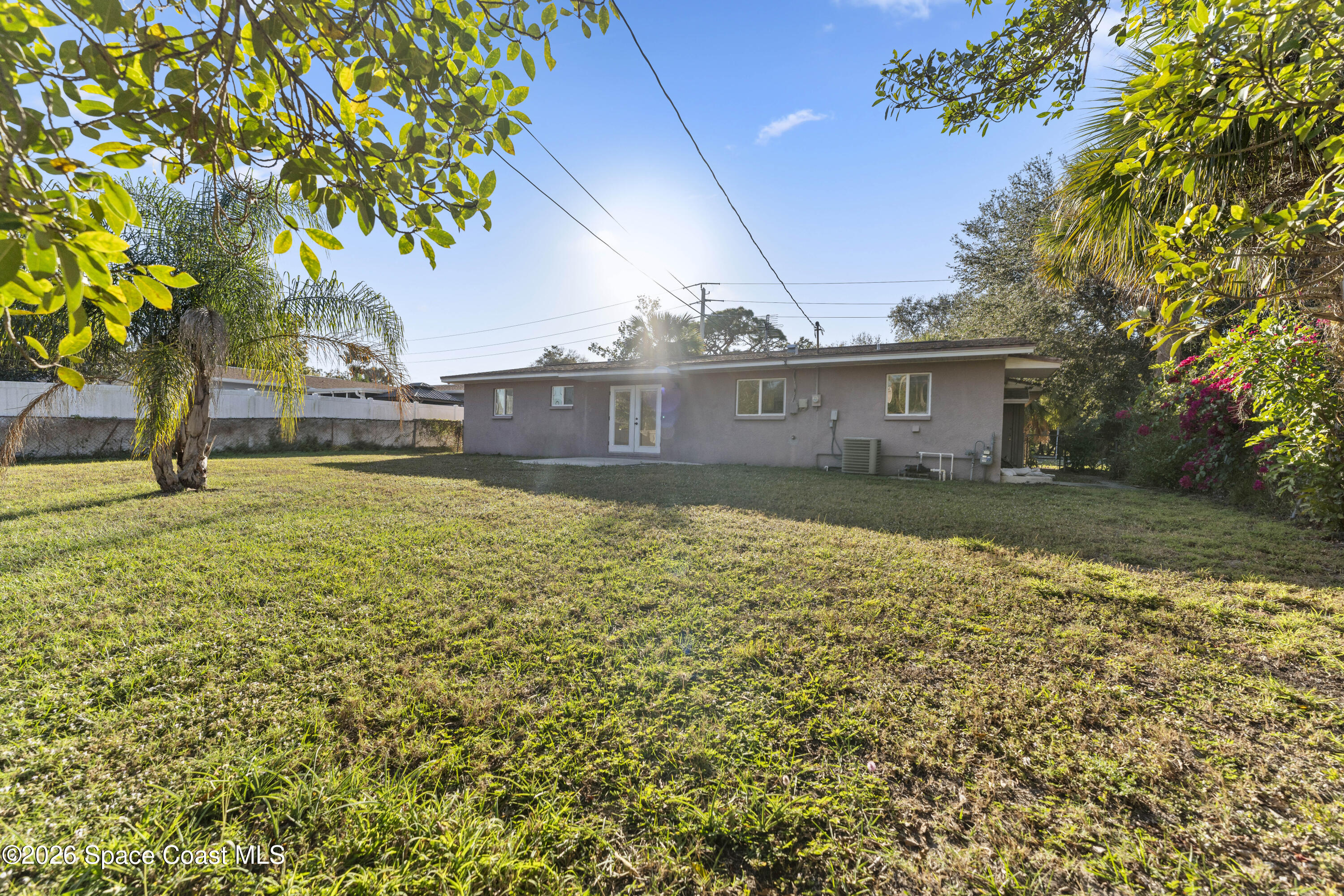 420 South Tropical Trail Merritt Island, FL 32952 - Photo 17 of 20 a view of a house with a yard