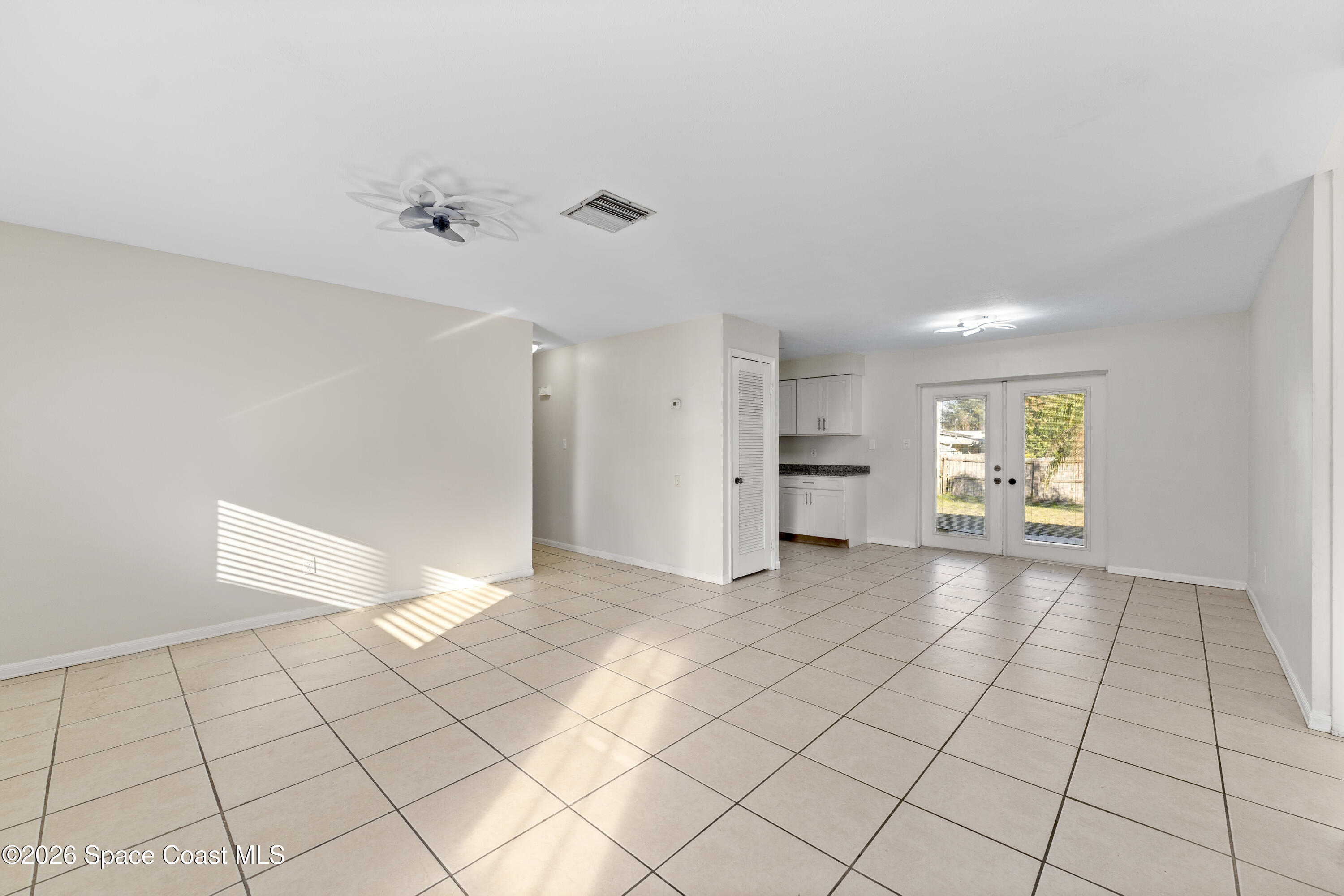 420 South Tropical Trail Merritt Island, FL 32952 - Photo 2 of 20 a view of an empty room and window