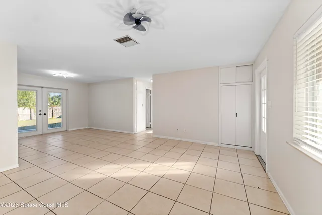 a view of an empty room with a window