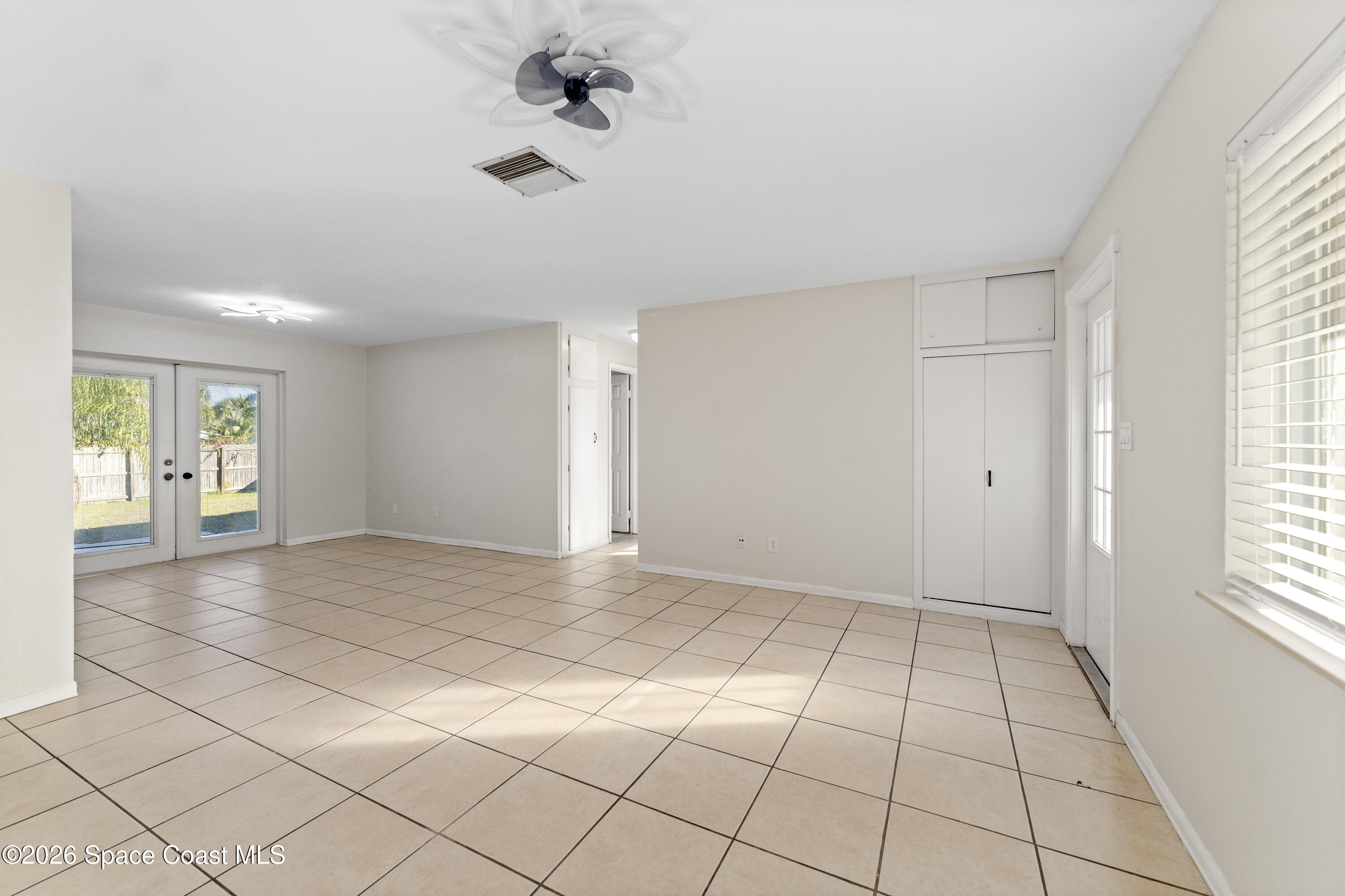 420 South Tropical Trail Merritt Island, FL 32952 - Photo 3 of 20 a view of an empty room with a window