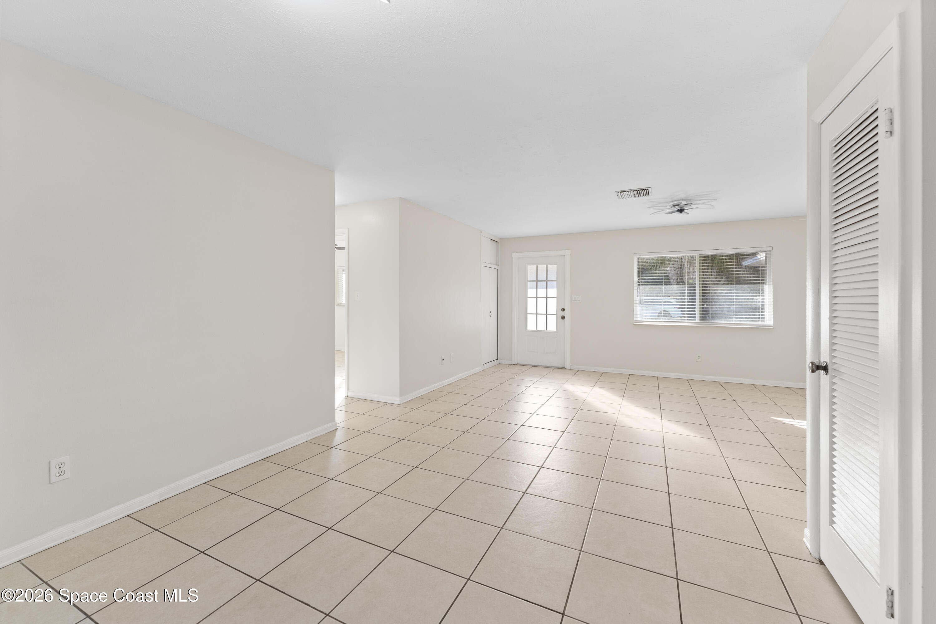 420 South Tropical Trail Merritt Island, FL 32952 - Photo 4 of 20 a view of an empty room and window