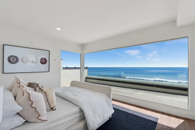 a bedroom with a bed and a night stand