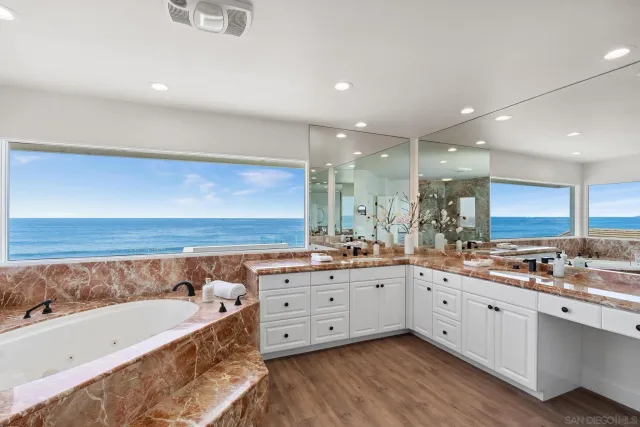 a bedroom with a bed and a wooden floor