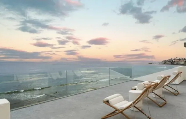 a bedroom with a bed lamp and a window