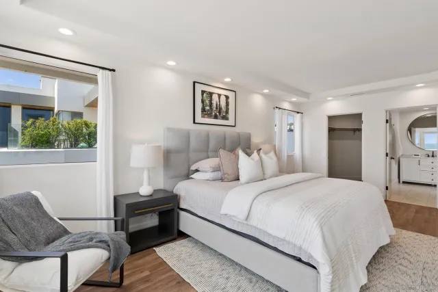 a bathroom with a double vanity sink mirror and toilet