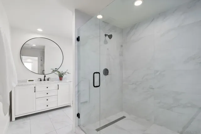a bathroom with a sink and vanity