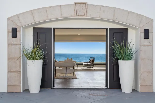 a view of living room with furniture and potted plant
