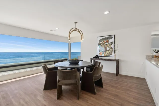 a dining room with a table and chairs