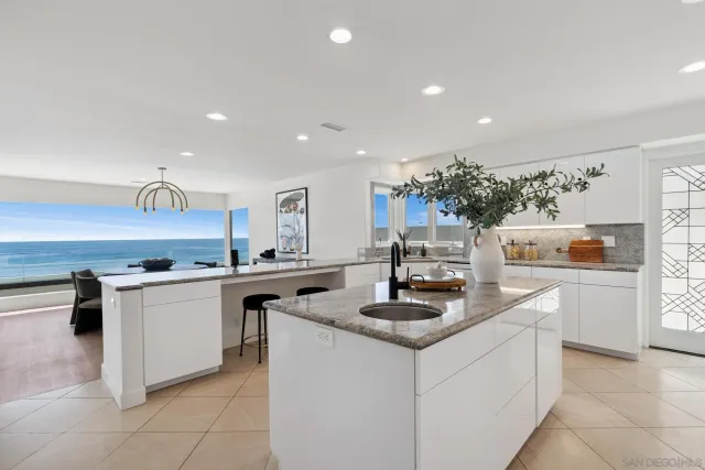 a kitchen with cabinets a sink and appliances