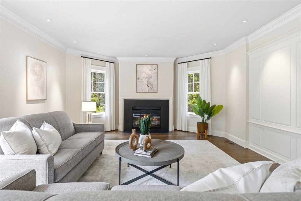 244 Musterfield Road Concord, MA 01742 - Photo 15 of 42 a living room with furniture and a fireplace