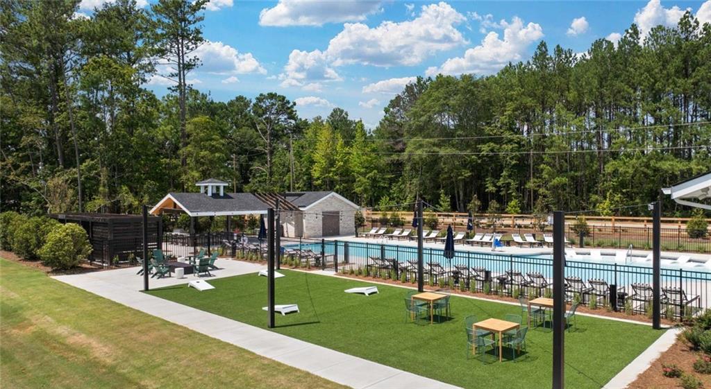 100 Rosemoore Drive Covington, GA 30014 - Photo 32 of 41 a view of a swimming pool with a patio