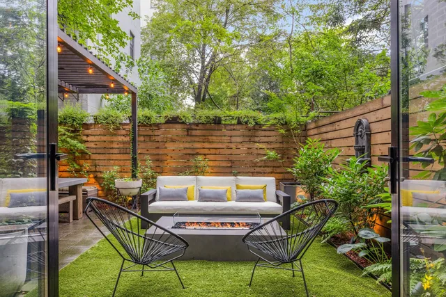 a view of a chairs and table in patio