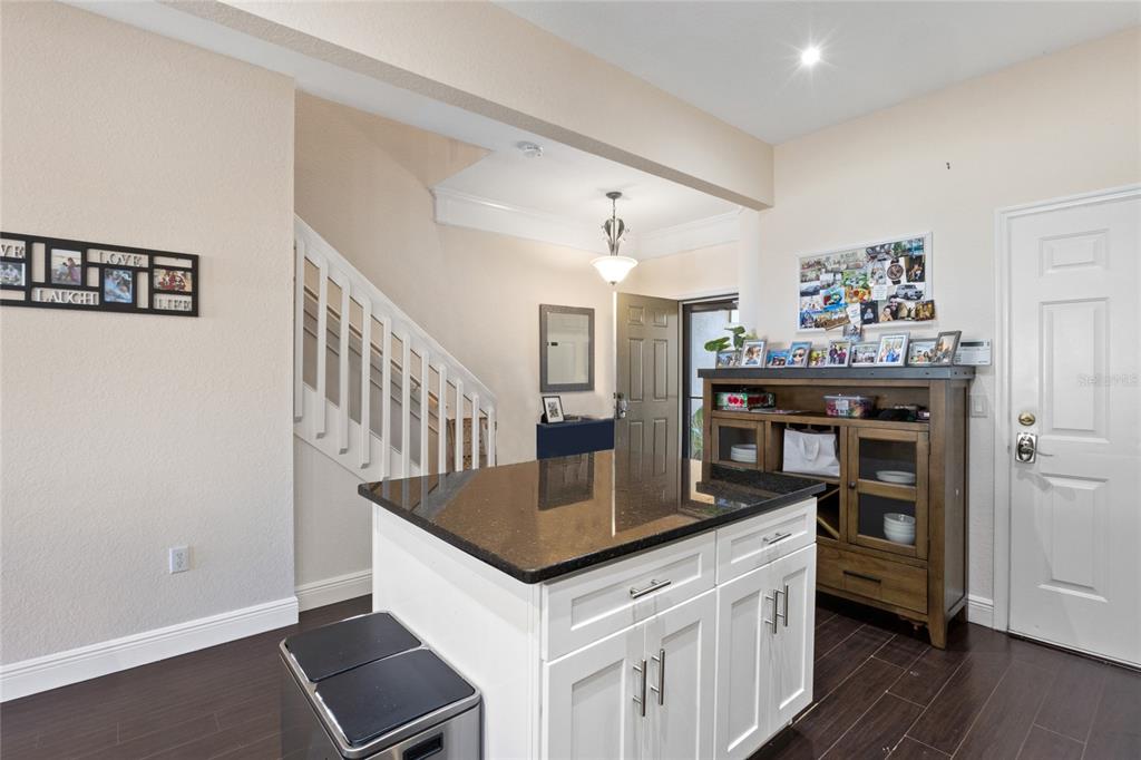 6435 Ranelagh Drive, Unit 104 Orlando, FL 32835 - Photo 15 of 36 a kitchen with stainless steel appliances granite countertop a stove and a refrigerator
