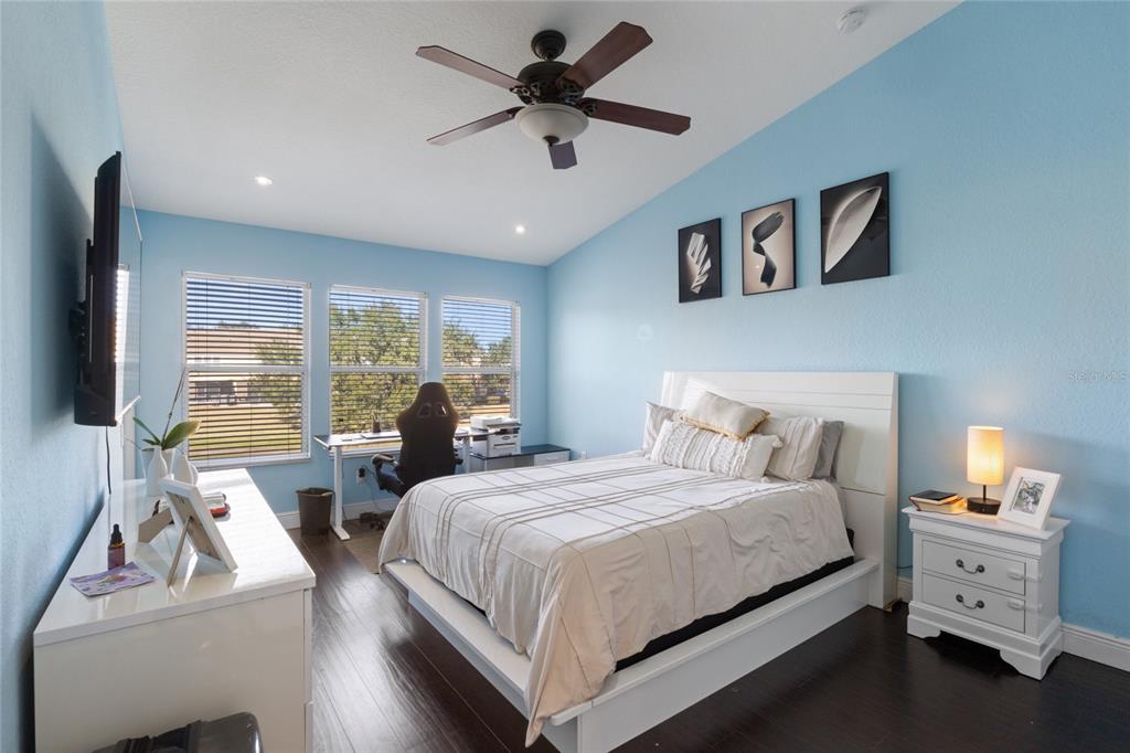 6435 Ranelagh Drive, Unit 104 Orlando, FL 32835 - Photo 16 of 36 a bed room with bed and a large window