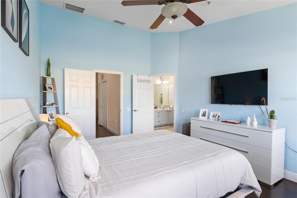 6435 Ranelagh Drive, Unit 104 Orlando, FL 32835 - Photo 18 of 36 a bedroom with a bed and a flat screen tv